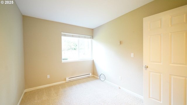 empty room featuring baseboards, a baseboard radiator, and light colored carpet