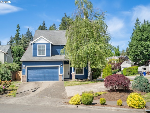 13688 Sandra Loop, Oregon City, OR 97045 - view of front of home featuring concrete driveway, a garage, fence, and brick siding
