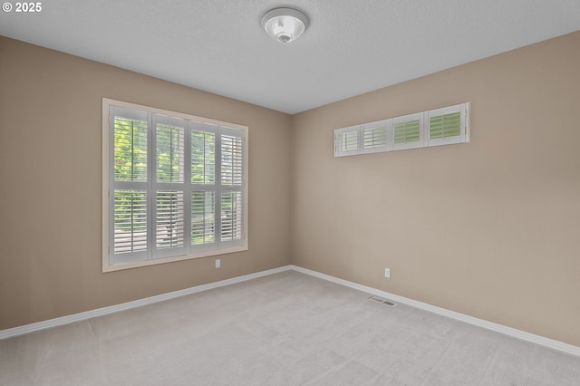 1318 NW Slocum Way, Portland, OR 97229 - carpeted empty room featuring baseboards and a textured ceiling