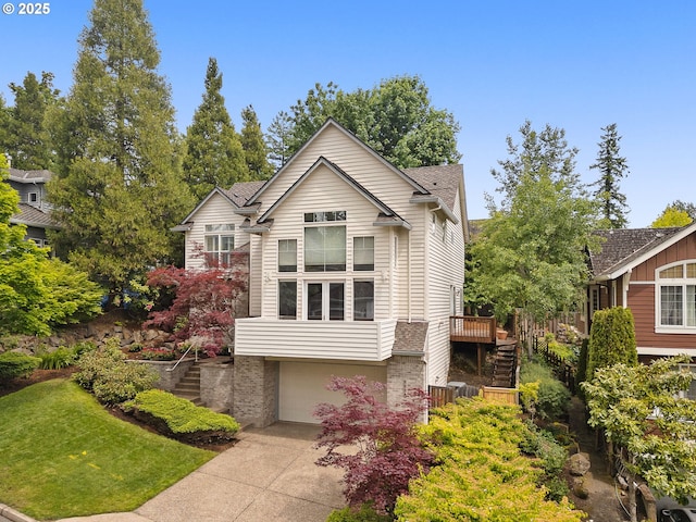 1318 NW Slocum Way, Portland, OR 97229 - view of front of home featuring stairway, driveway, a garage, a wooden deck, and brick siding
