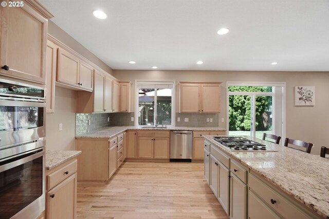 2475 NE 10th Ave, Hillsboro, OR 97124 - kitchen featuring stainless steel appliances, light brown cabinets, plenty of natural light, and recessed lighting