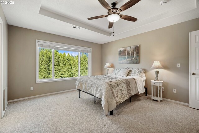 2475 NE 10th Ave, Hillsboro, OR 97124 - bedroom with carpet, a tray ceiling, baseboards, and a ceiling fan