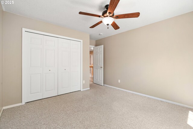 2475 NE 10th Ave, Hillsboro, OR 97124 - unfurnished bedroom with light colored carpet, a closet, baseboards, and ceiling fan