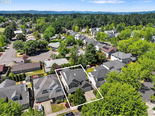 2475 NE 10th Ave, Hillsboro, OR 97124 - aerial perspective of suburban area with property parcel outlined and a mountainous background