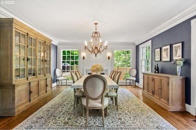 2505 SW Hillcrest Dr, Portland, OR 97201 - dining room featuring a chandelier, ornamental molding, wood finished floors, baseboards, and baseboard heating