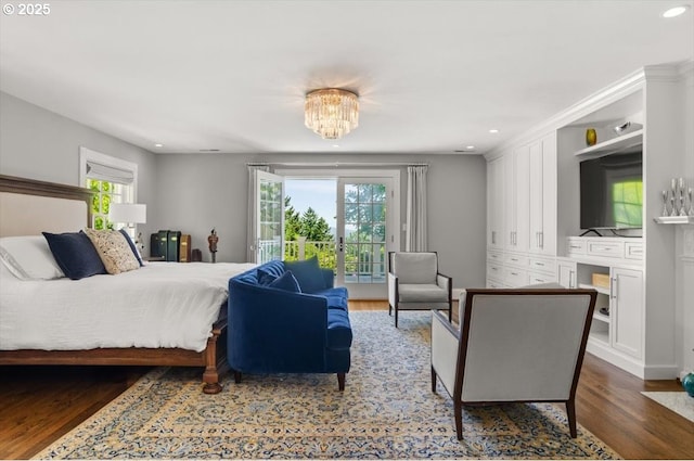 2505 SW Hillcrest Dr, Portland, OR 97201 - bedroom featuring access to outside, dark wood-type flooring, multiple windows, recessed lighting, and a chandelier