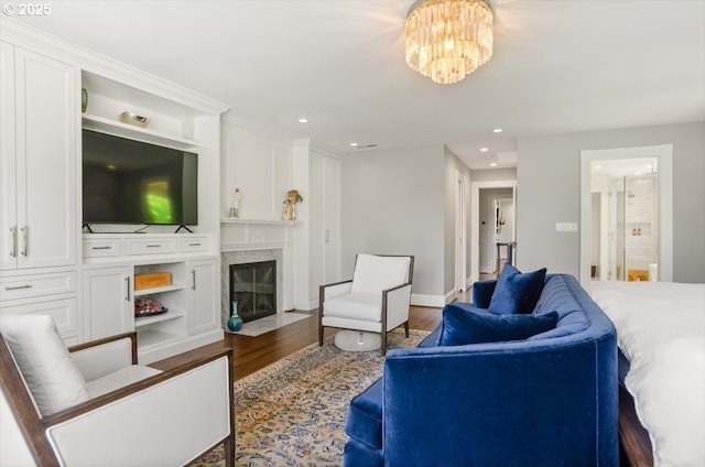 2505 SW Hillcrest Dr, Portland, OR 97201 - living room featuring dark wood-style flooring, recessed lighting, a high end fireplace, a chandelier, and baseboards