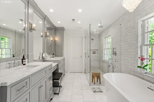 2505 SW Hillcrest Dr, Portland, OR 97201 - bathroom featuring a stall shower, vanity, a freestanding tub, recessed lighting, and tile patterned flooring