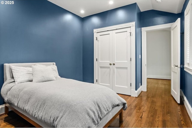 2505 SW Hillcrest Dr, Portland, OR 97201 - bedroom featuring wood finished floors, a closet, baseboards, and lofted ceiling