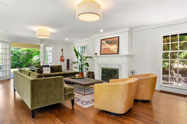 2505 SW Hillcrest Dr, Portland, OR 97201 - living room with ornamental molding, wood finished floors, a high end fireplace, and recessed lighting
