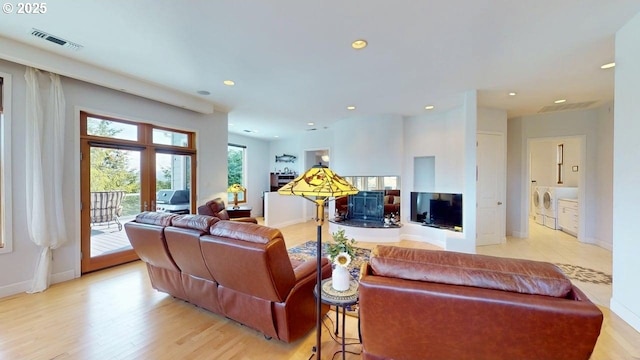 94414 Tom Cat Hill Rd, Gold Beach, OR 97444 - living area featuring washing machine and dryer, light wood-style floors, and recessed lighting