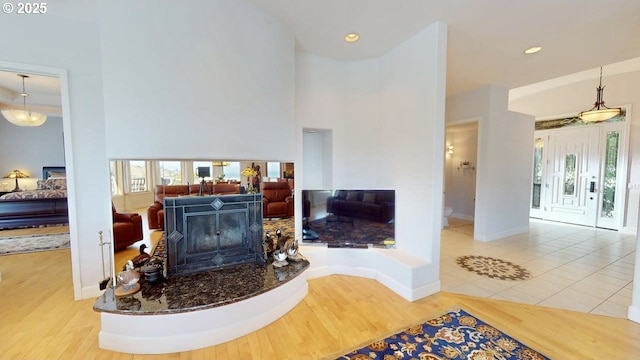 94414 Tom Cat Hill Rd, Gold Beach, OR 97444 - living area featuring wood finished floors, a towering ceiling, and recessed lighting