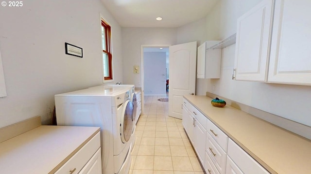 94414 Tom Cat Hill Rd, Gold Beach, OR 97444 - laundry room with washing machine and dryer, cabinet space, and light tile patterned floors