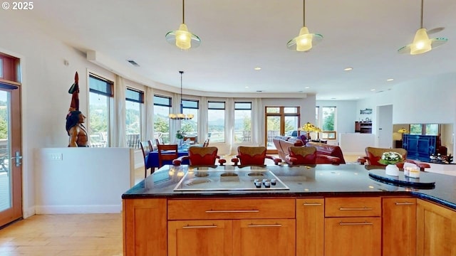 94414 Tom Cat Hill Rd, Gold Beach, OR 97444 - kitchen with electric cooktop, light wood-type flooring, pendant lighting, open floor plan, and recessed lighting