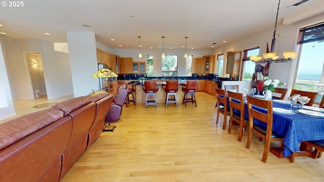 94414 Tom Cat Hill Rd, Gold Beach, OR 97444 - dining space featuring recessed lighting, light wood-style flooring, and a chandelier