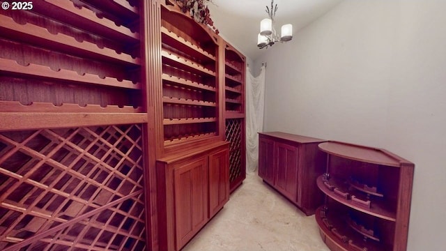 94414 Tom Cat Hill Rd, Gold Beach, OR 97444 - wine cellar featuring a chandelier and unfinished concrete floors