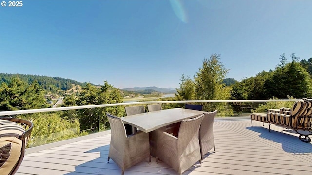 94414 Tom Cat Hill Rd, Gold Beach, OR 97444 - deck featuring a mountain view, a forest view, and outdoor dining space