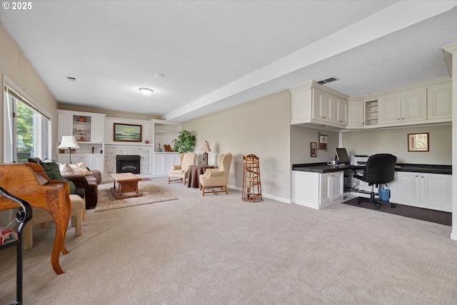 living room featuring carpet flooring, a fireplace, and baseboards