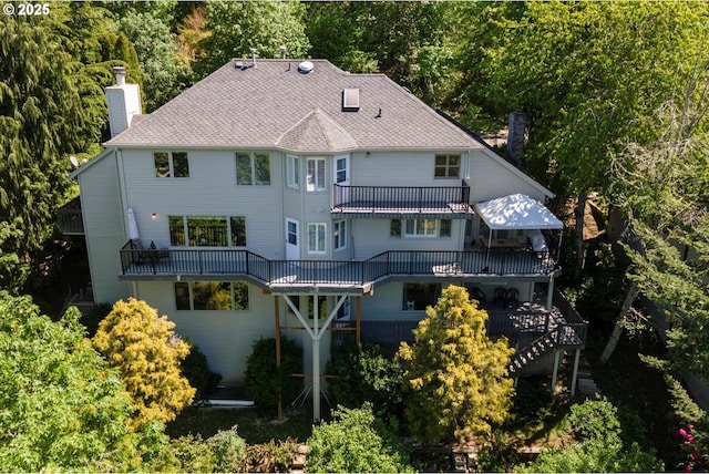 18280 Delenka Ln, Lake Oswego, OR 97034 - back of property featuring a chimney, stairway, and a deck