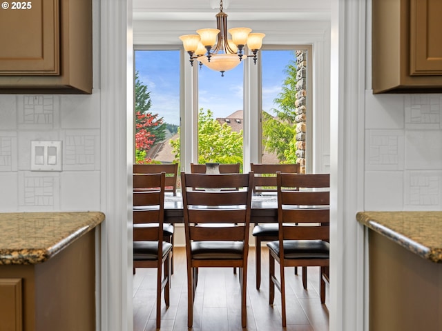 9540 SE Spyglass Dr, Happy Valley, OR 97086 - dining area featuring a healthy amount of sunlight and a chandelier