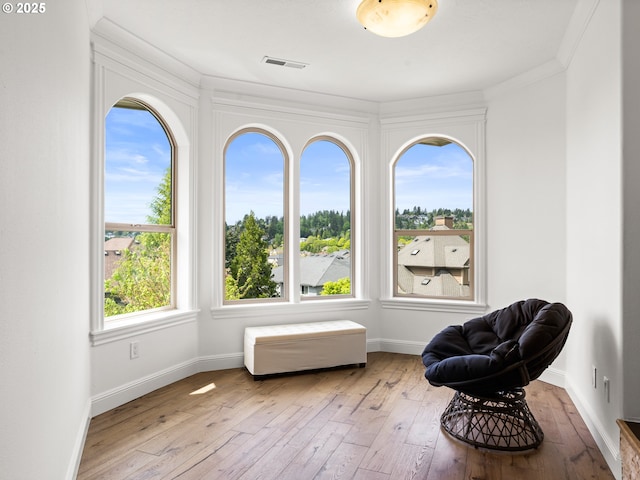 9540 SE Spyglass Dr, Happy Valley, OR 97086 - sitting room featuring wood-type flooring, ornamental molding, baseboards, and visible vents