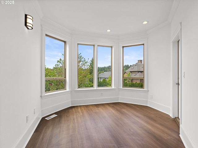 9540 SE Spyglass Dr, Happy Valley, OR 97086 - empty room with crown molding, plenty of natural light, dark wood-style floors, and visible vents