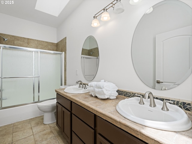 9540 SE Spyglass Dr, Happy Valley, OR 97086 - full bathroom with a sink, shower / bath combination with glass door, a skylight, and double vanity