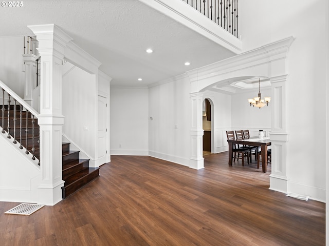 9540 SE Spyglass Dr, Happy Valley, OR 97086 - interior space featuring stairs, dark wood-style flooring, arched walkways, and recessed lighting