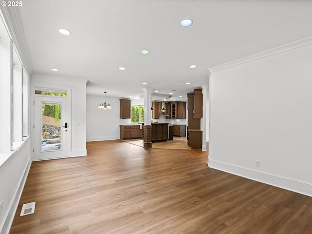 9540 SE Spyglass Dr, Happy Valley, OR 97086 - unfurnished living room with crown molding, recessed lighting, baseboards, and visible vents