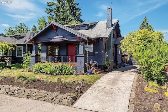 4915 NE 8th Ave, Portland, OR 97211 - craftsman-style home featuring a porch, a chimney, and a shingled roof