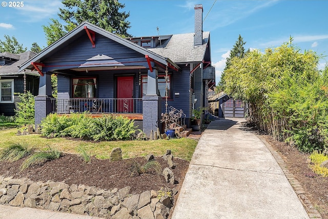 4915 NE 8th Ave, Portland, OR 97211 - view of front of property with a porch and a chimney