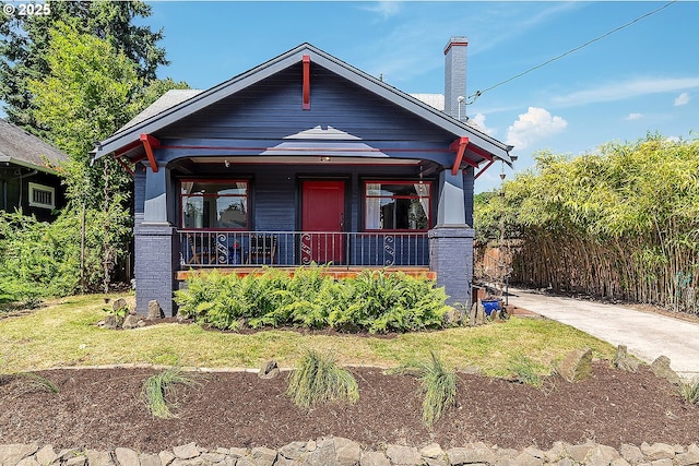 4915 NE 8th Ave, Portland, OR 97211 - view of front of property with covered porch and a chimney