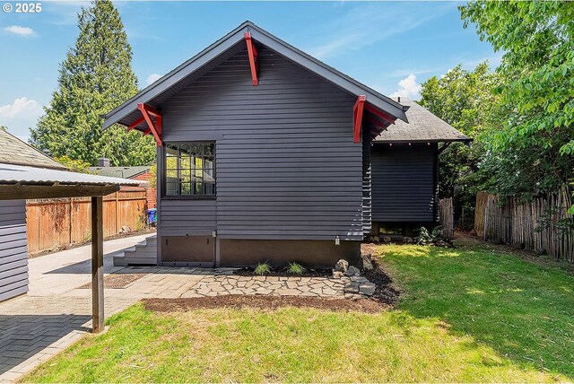 4915 NE 8th Ave, Portland, OR 97211 - view of home's exterior with a patio area