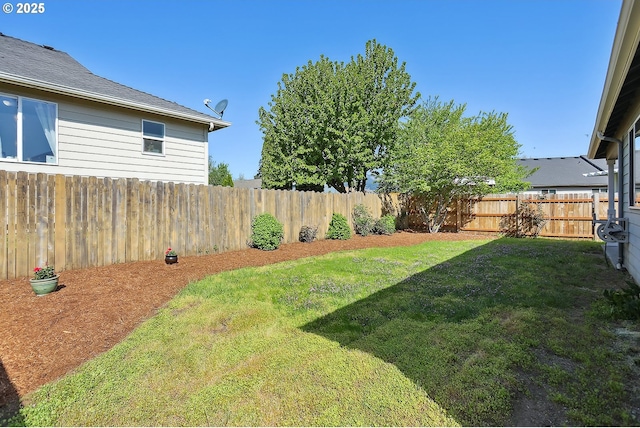 view of yard with a fenced backyard