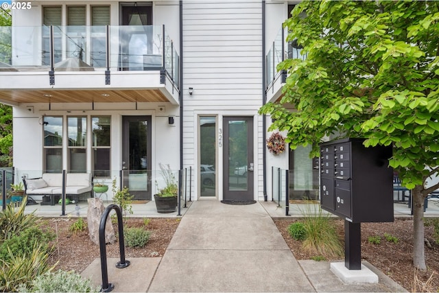 property entrance with stucco siding