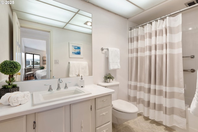 full bathroom with toilet, shower / bath combo with shower curtain, and vanity