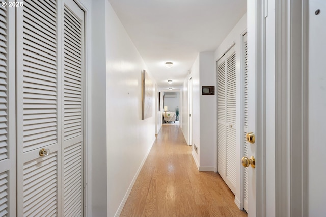 corridor featuring light hardwood / wood-style flooring