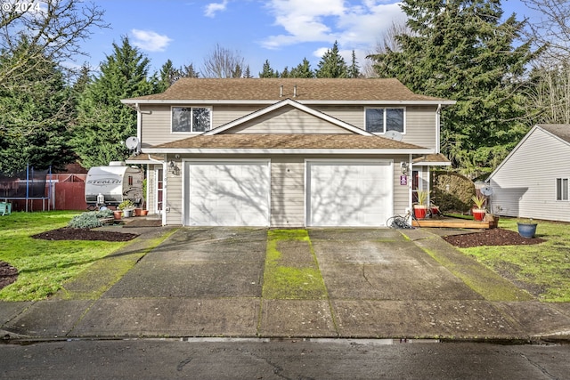 front of property with a garage