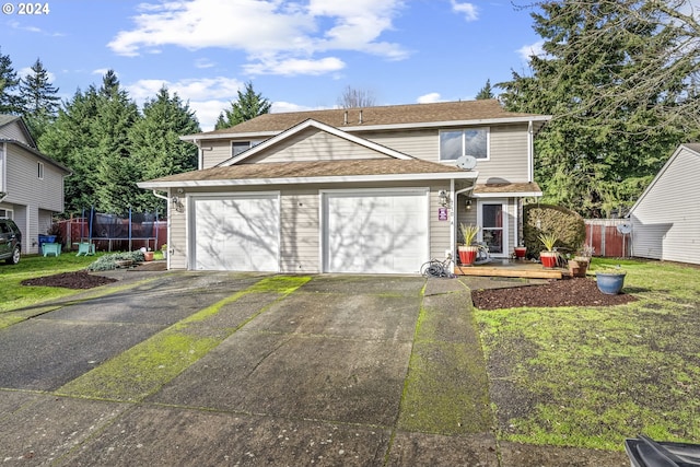 front facade with a front lawn, a trampoline, and a garage