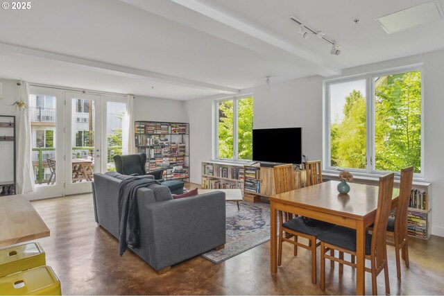 325 NE Graham St Unit 8, Portland, OR 97212 - living room featuring rail lighting and finished concrete flooring