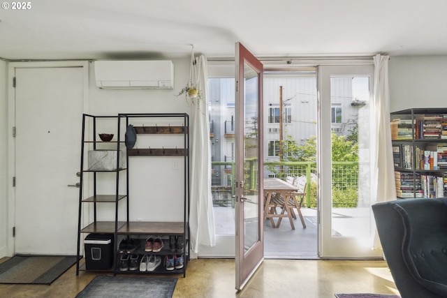 325 NE Graham St Unit 8, Portland, OR 97212 - doorway with an AC wall unit, plenty of natural light, concrete floors, and french doors