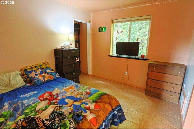 66663 Gunderson Rd, North Bend, OR 97459 - bedroom featuring light tile patterned flooring and baseboards