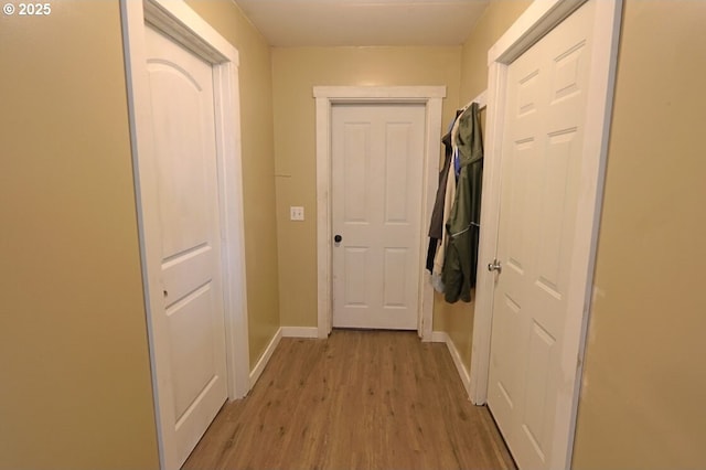 66663 Gunderson Rd, North Bend, OR 97459 - hallway with light wood finished floors and baseboards