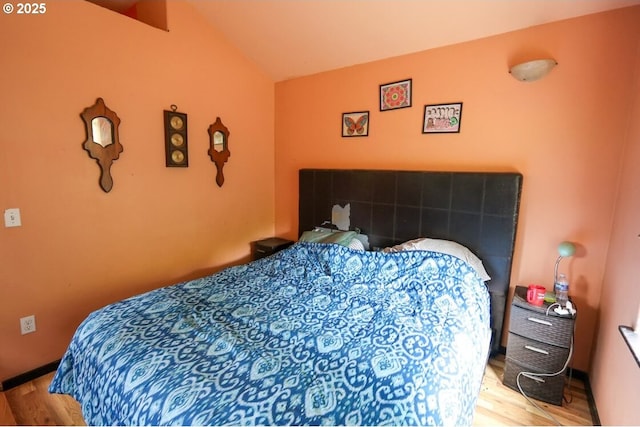 66663 Gunderson Rd, North Bend, OR 97459 - bedroom featuring wood finished floors and lofted ceiling