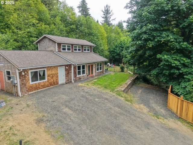 66663 Gunderson Rd, North Bend, OR 97459 - view of front of house featuring driveway and a shingled roof