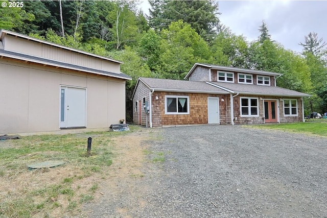 66663 Gunderson Rd, North Bend, OR 97459 - mid-century inspired home with gravel driveway