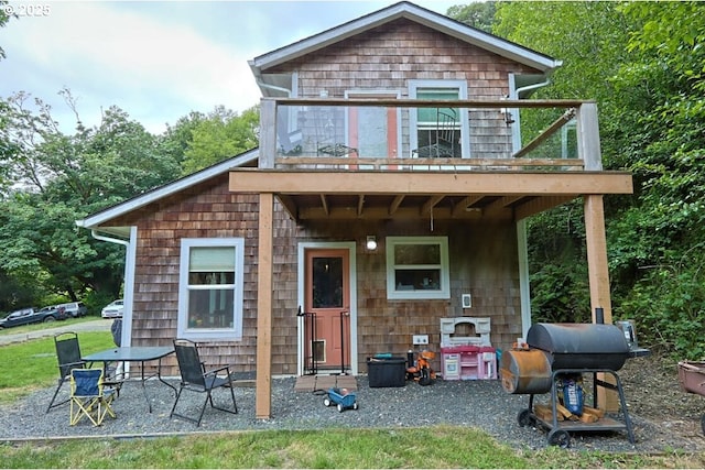 66663 Gunderson Rd, North Bend, OR 97459 - back of house with a balcony and a patio area