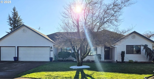 ranch-style house with a front yard and a garage