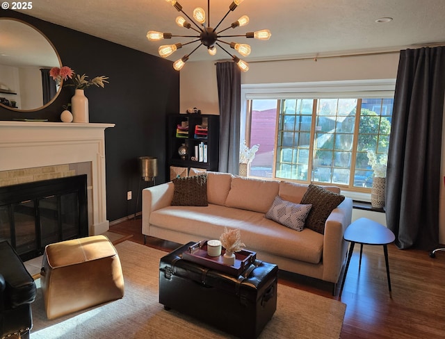 living room featuring a chandelier and wood-type flooring