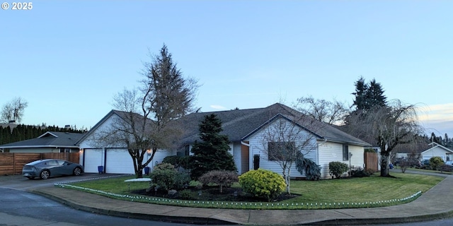 view of front of house with a front lawn and a garage